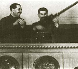 Stalin at the Presidium of XVII Congress of VKP(B) with the present of a workers delegation. 1934. Photo